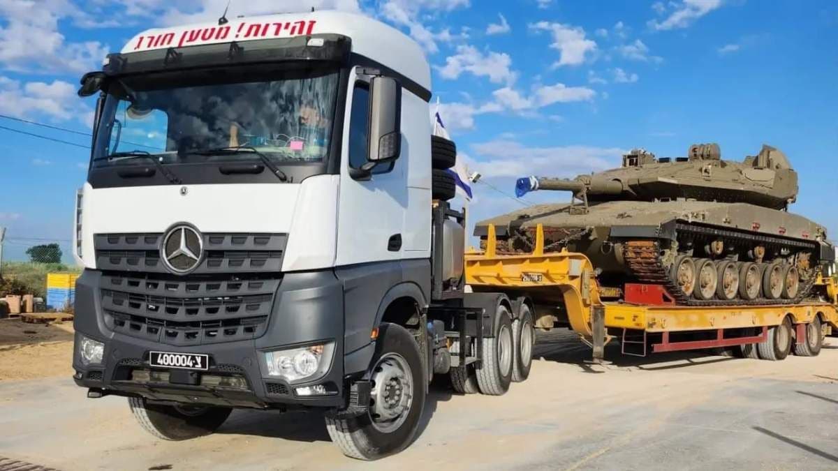 Mercedes trctor head transporting Israeli Tank